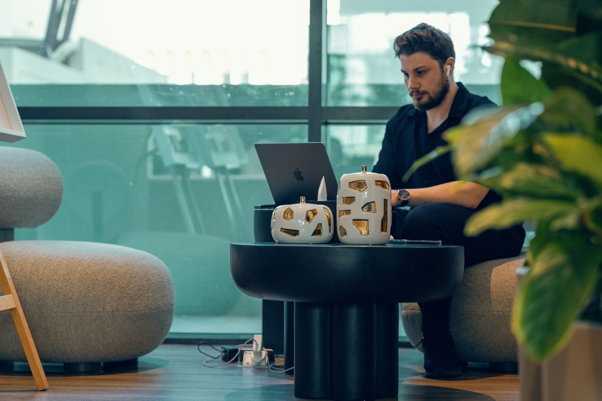 Zeid Alsayid working on cinematic photo and video post-production using AI tools at a modern workspace in Dubai.